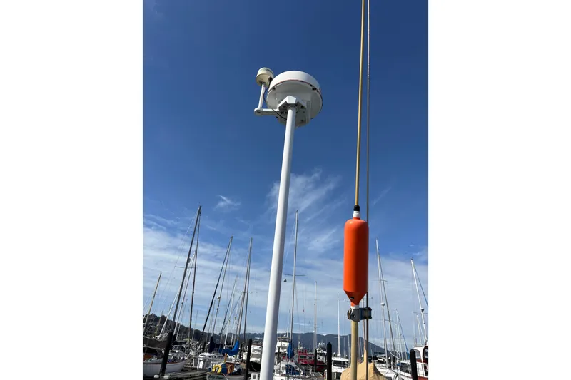 Slide: The Image of Sailboat masts and equipment on a Beneteau First 375, 1986, under a clear blue sky. - 20