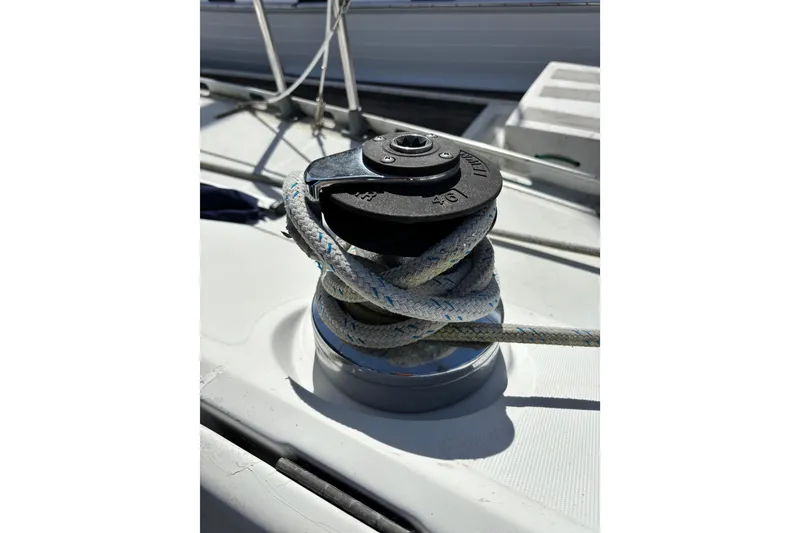 Slide: The Image of Sailboat masts and equipment on a Beneteau First 375, 1986, under a clear blue sky. - 21