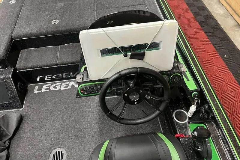 Slide: The Image of 2018 Legend Boats V20 cockpit with steering wheel and control panel. - 5