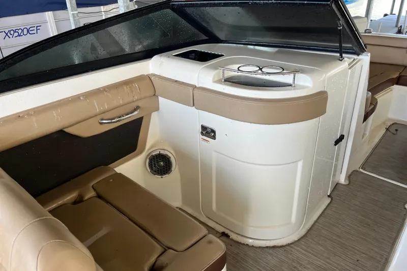 Slide: The Image of 2016 Sea Ray 270 Sundeck interior with seating and storage area. - 21