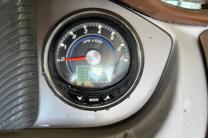 Slide: The Image of Close-up of 2016 Sea Ray 270 Sundeck tachometer displaying RPM and engine hours. - 28