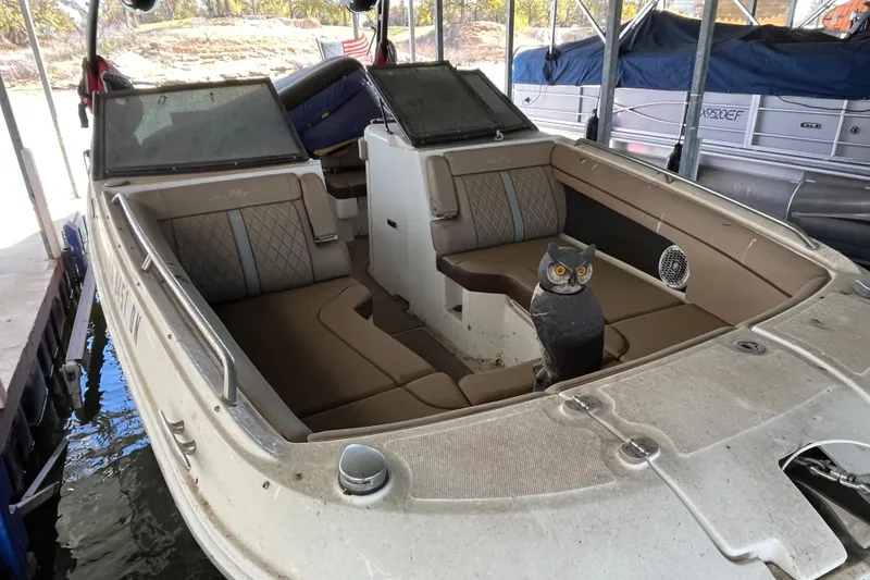 Slide: The Image of 2016 Sea Ray 270 Sundeck with owl decoy on deck, docked in marina. - 3