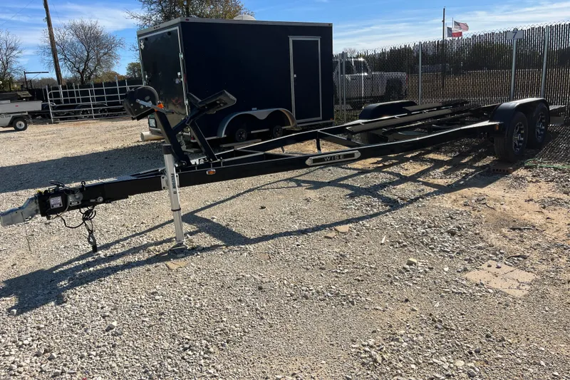 Slide: The Image of Trailer for 2016 Sea Ray 270 Sundeck on gravel lot, surrounded by fencing. - 31