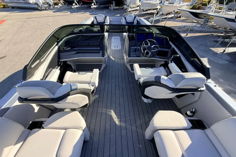 Slide: The Image of Luxurious 2026 Avalon Excalibur boat interior with quad loungers and advanced controls. - 16