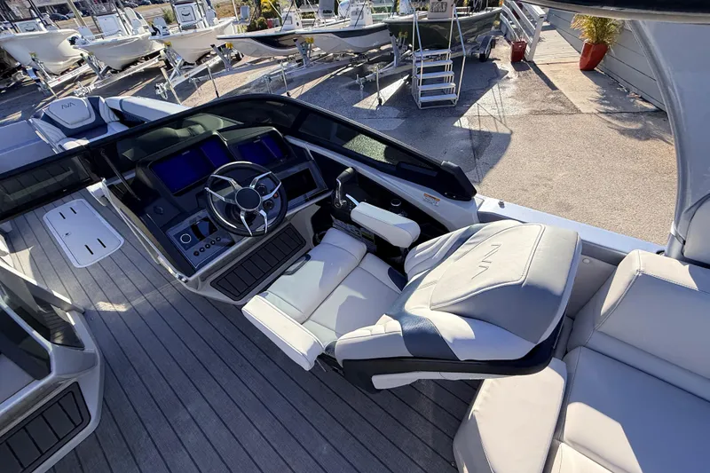 Slide: The Image of 2026 Avalon Excalibur boat interior with modern dashboard and joystick controls. - 17