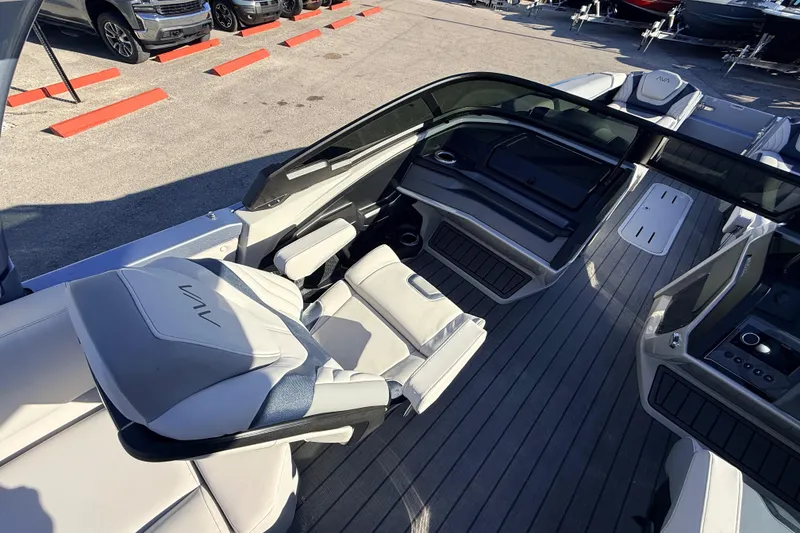 Slide: The Image of 2026 Avalon Excalibur boat interior with luxurious seating and modern dashboard. - 18