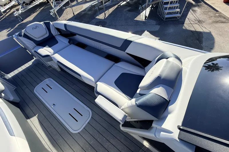 Slide: The Image of Luxurious seating on 2026 Avalon Excalibur Windshield Quad Lounger boat, featuring sleek design and comfort. - 21