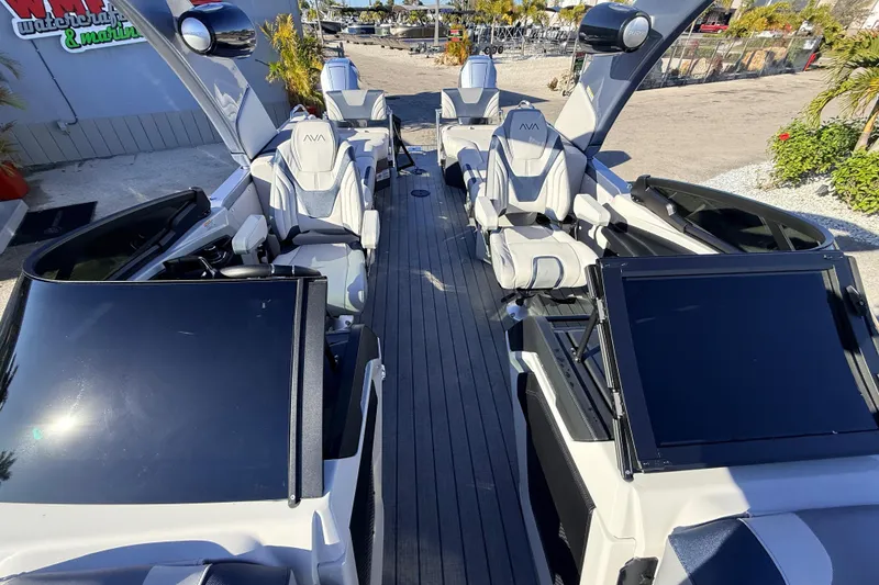 Slide: The Image of 2026 Avalon Excalibur boat interior with luxurious seating and advanced controls. - 26