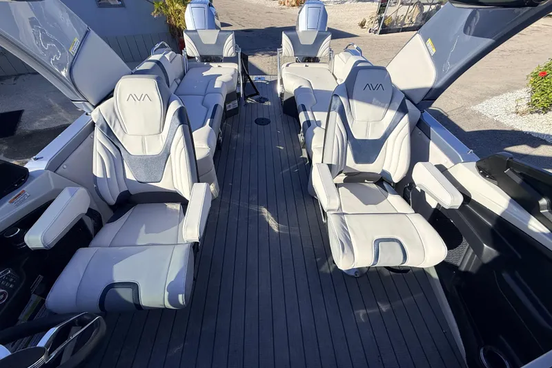 Slide: The Image of Luxurious interior of 2026 Avalon Excalibur Windshield Quad Lounger with premium seating and joystick controls. - 27