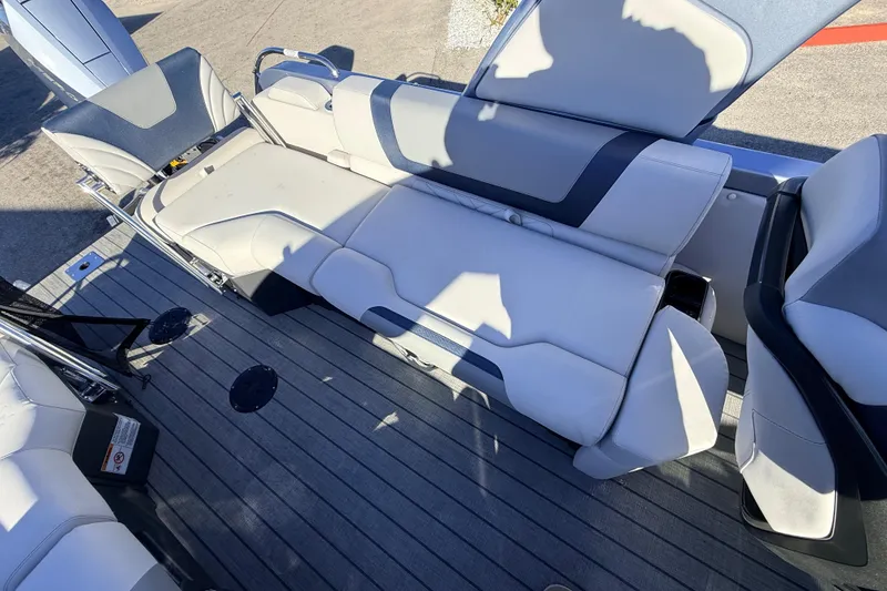 Slide: The Image of Luxurious seating on 2026 Avalon Excalibur Windshield Quad Lounger boat, featuring premium upholstery. - 29
