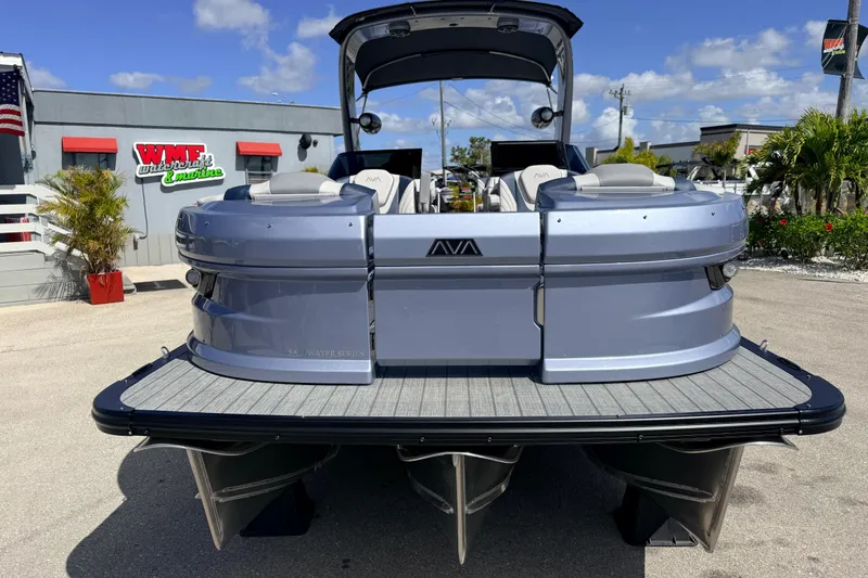 Slide: The Image of 2026 Avalon Excalibur Windshield Quad Lounger boat with twin Mercury 425hp engines at dealership. - 3