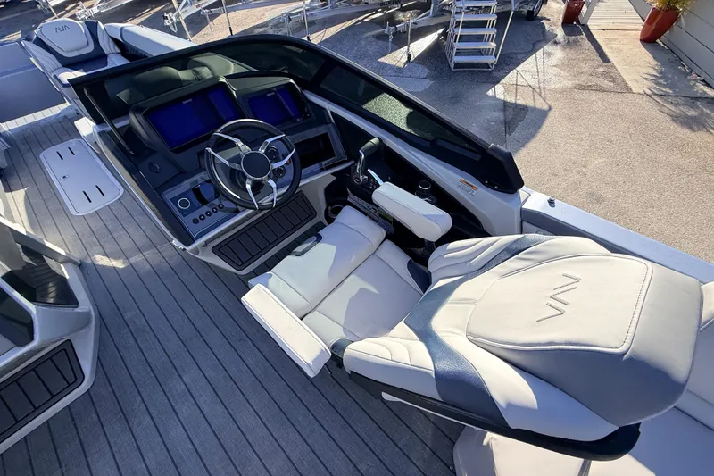 Slide: The Image of 2026 Avalon Excalibur boat cockpit with modern controls and luxurious seating. - 31