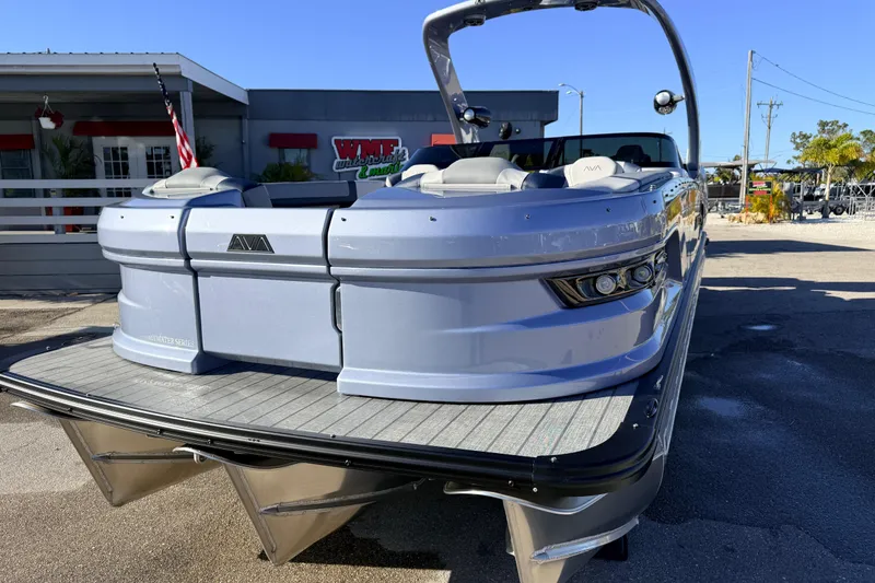 Slide: The Image of 2026 Avalon Excalibur Windshield Quad Lounger boat with twin Mercury 425hp engines. - 4