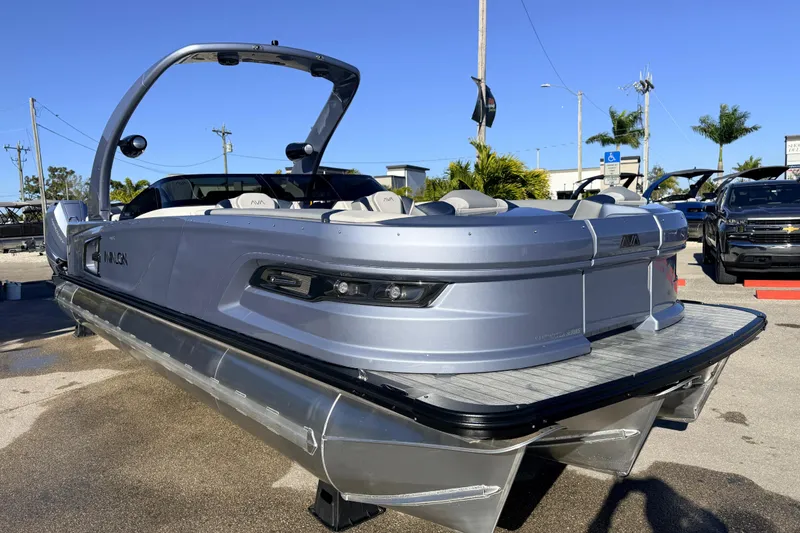 Slide: The Image of 2026 Avalon Excalibur Windshield Quad Lounger boat with twin Mercury 425hp engines. - 6