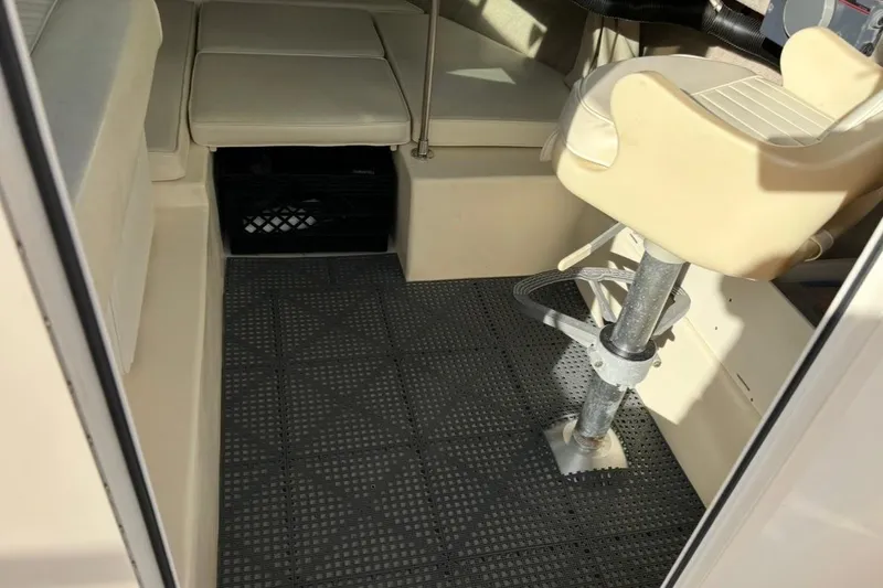 Slide: The Image of Interior of 2008 Parker 2320 SL Sport Cabin with seating and non-slip flooring. - 16