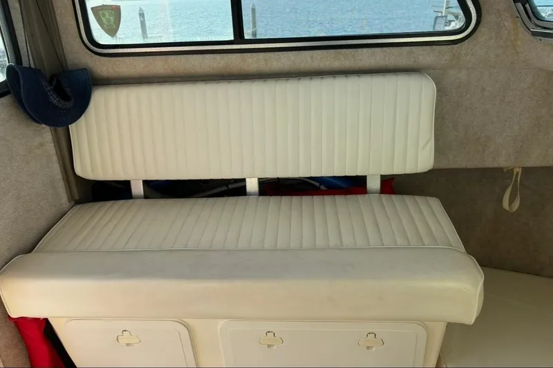 Slide: The Image of Interior of 2008 Parker 2320 SL Sport Cabin with white cushioned seating. - 17