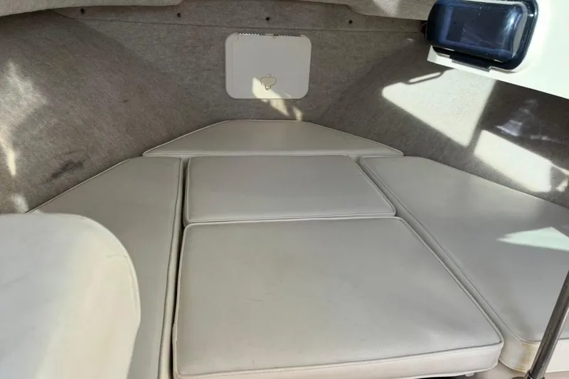 Slide: The Image of Interior cabin of 2008 Parker 2320 SL Sport Cabin boat with cushioned seating. - 18