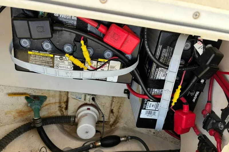 Slide: The Image of Battery compartment of a 2008 Parker 2320 SL Sport Cabin boat with wiring and connectors. - 21