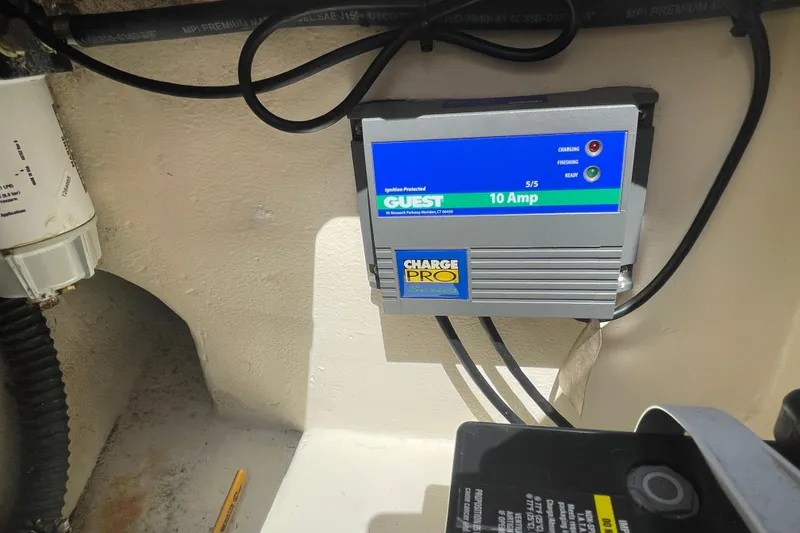 Slide: The Image of Battery charger in a 2008 Parker 2320 SL Sport Cabin boat. - 25