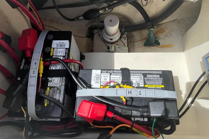 Slide: The Image of Battery compartment of a 2008 Parker 2320 SL Sport Cabin boat, showing wiring and connections. - 27