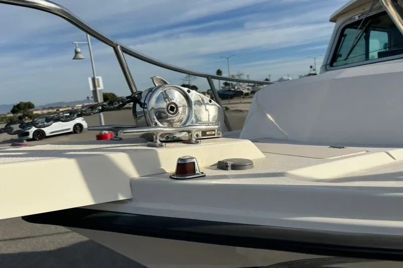 Slide: The Image of 2008 Parker 2320 SL Sport Cabin boat deck with anchor chain and winch. - 5