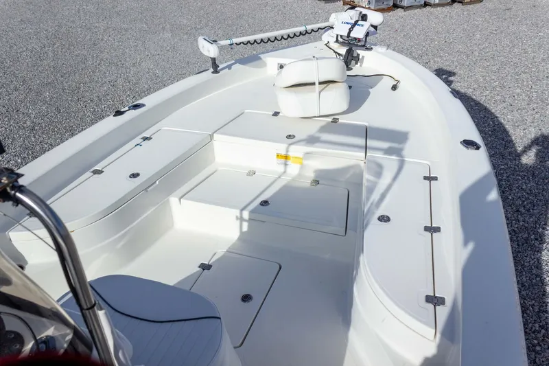 Slide: The Image of 2014 NauticStar 2400 Sport boat interior with seating and storage compartments. - 13