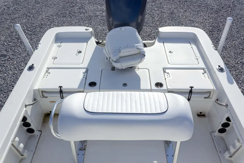 Slide: The Image of 2014 NauticStar 2400 Sport boat interior with seating and storage compartments. - 27