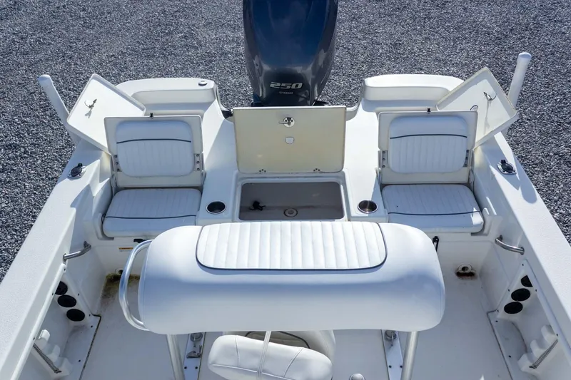 Slide: The Image of 2014 NauticStar 2400 Sport boat interior with seating and storage compartments. - 28