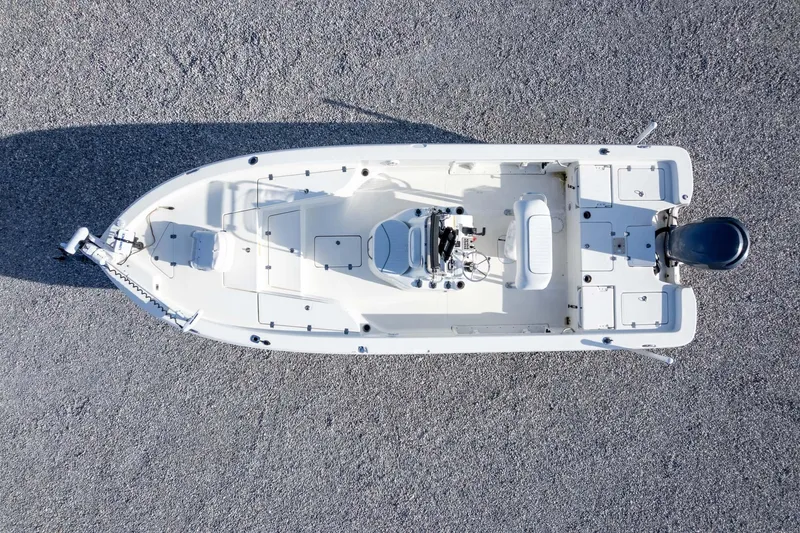 Slide: The Image of Overhead view of a 2014 NauticStar 2400 Sport boat on gravel surface. - 31