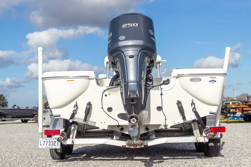 Slide: The Image of 2014 NauticStar 2400 Sport boat with Yamaha 250 engine on trailer, rear view. - 9