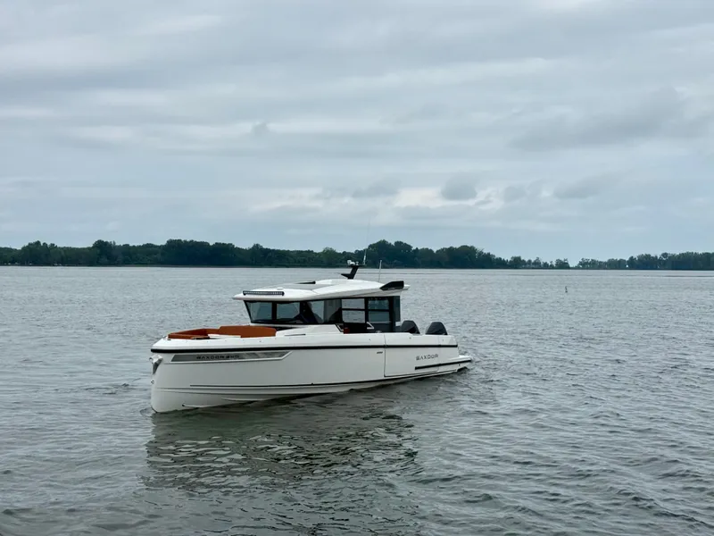 Slide: The Image of Saxdor 340 GTWA 2027 on calm water with a cloudy sky. - 21