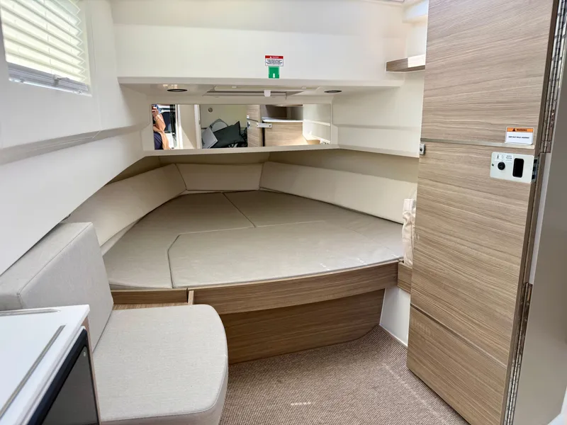 Slide: The Image of Interior of a 2027 Saxdor 340 GTWA with a cozy sleeping cabin and wooden elements. - 18