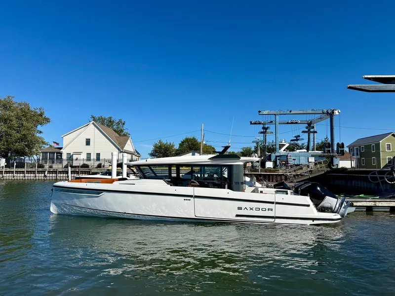 Slide: The Image of 2027 Saxdor 340 GTWA in a harbor, featuring sleek design and clean lines. - 26
