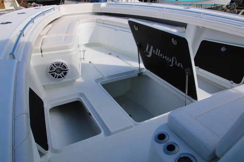 Slide: The Image of 2022 Yellowfin 39 Offshore boat interior with seating and storage compartments. - 10