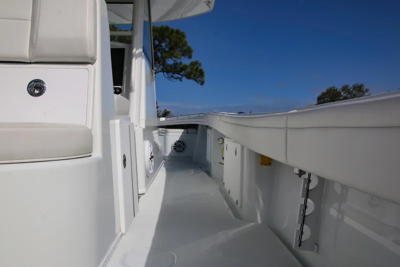 Slide: The Image of 2022 Yellowfin 39 Offshore boat interior with sleek white design and modern features. - 12