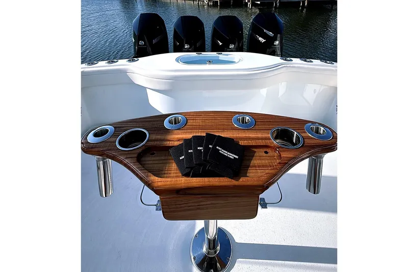 Slide: The Image of 2022 Yellowfin 39 Offshore boat with wooden rod holder and Mercury engines. - 3