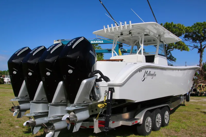 Slide: The Image of 2022 Yellowfin 39 Offshore boat with four powerful outboard engines on a trailer. - 31
