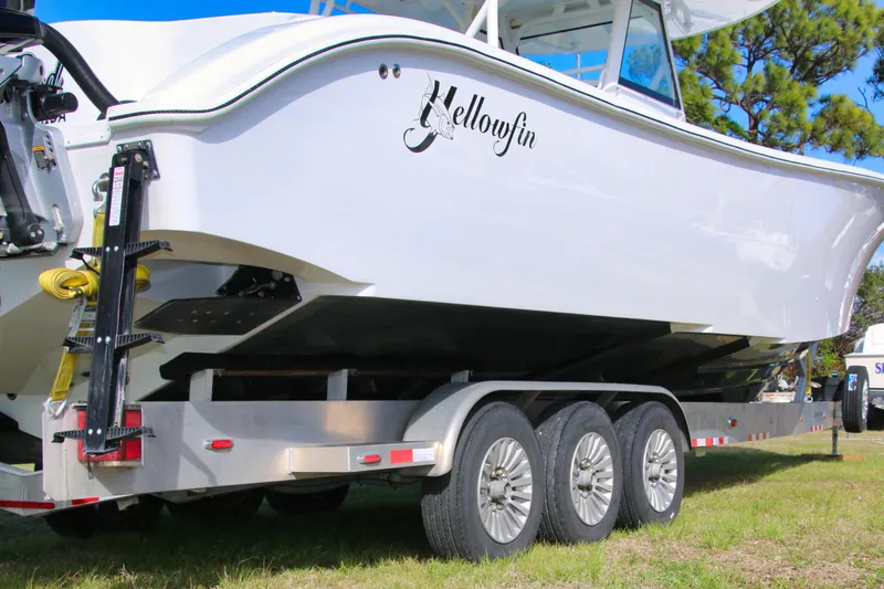 Slide: The Image of 2022 Yellowfin 39 Offshore boat on trailer, side view, outdoors. - 35
