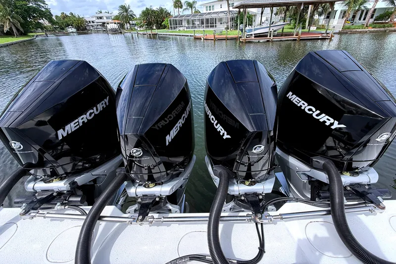 Slide: The Image of 2022 Yellowfin 39 Offshore boat with four Mercury outboard engines on a calm waterway. - 8