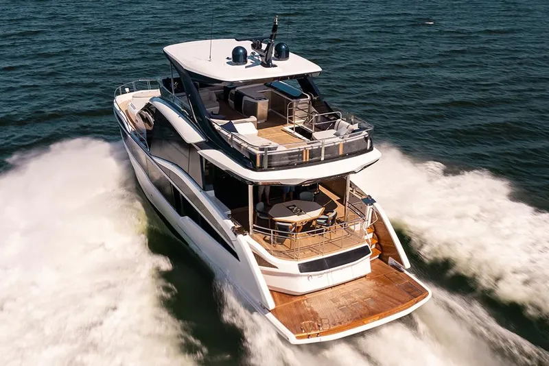 Slide: The Image of Manufacturer Provided Image: 2025 Galeon 620 FLY yacht cruising on open water, showcasing luxury design. - 1