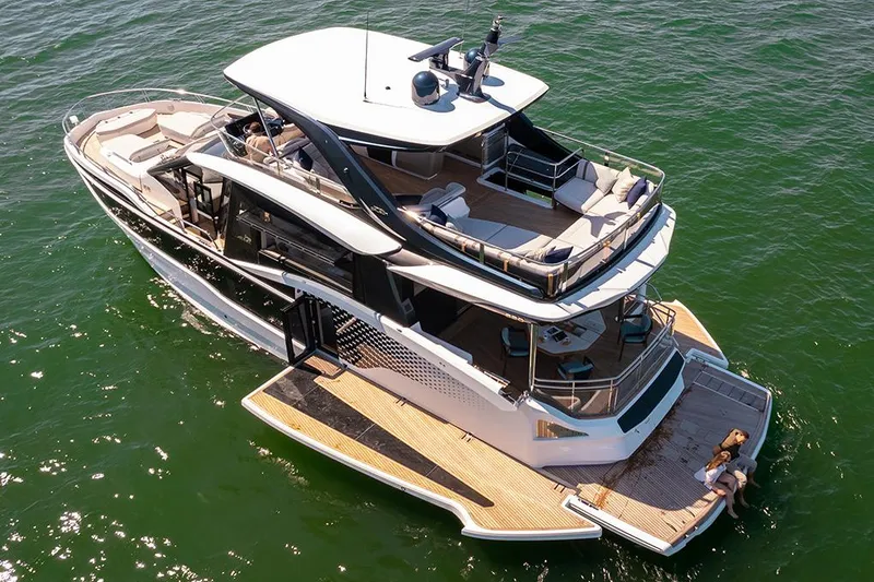 Slide: The Image of Manufacturer Provided Image: Luxurious 2025 Galeon 620 FLY yacht cruising on open water, showcasing elegant design and spacious decks. - 3