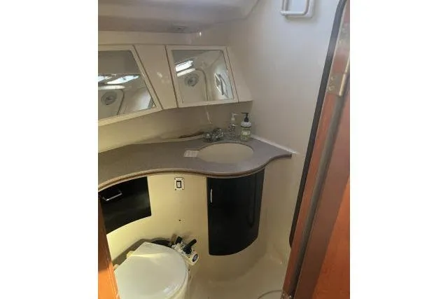 Slide: The Image of Interior of 1995 Hunter Legend 40.5 yacht bathroom with sink and toilet. - 16