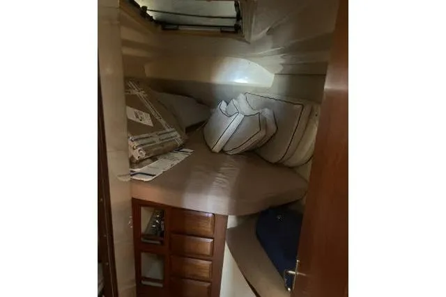 Slide: The Image of Cozy cabin interior of 1995 Hunter Legend 40.5 sailboat with cushions and storage. - 18