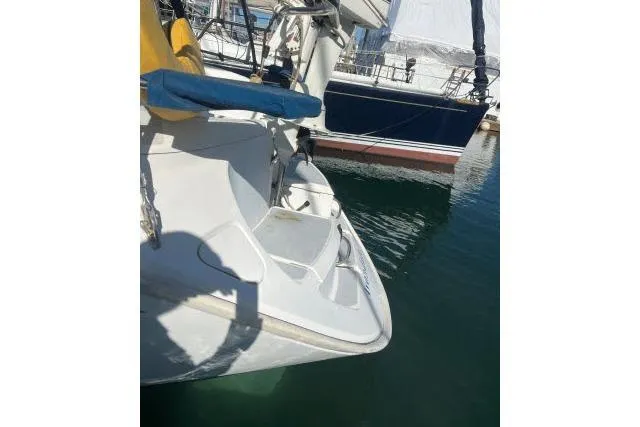 Slide: The Image of 1995 Hunter Legend 40.5 sailboat docked in marina, partial view. - 22