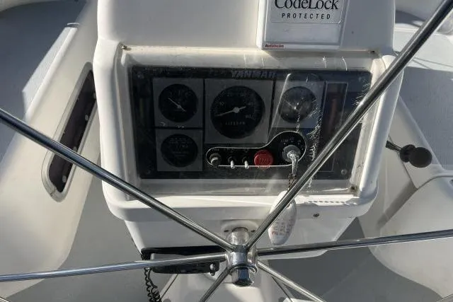 Slide: The Image of Steering wheel and control panel of 1995 Hunter Legend 40.5 sailboat. - 23