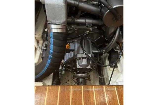 Slide: The Image of Engine compartment of a 1995 Hunter Legend 40.5 sailboat, showcasing mechanical components. - 28