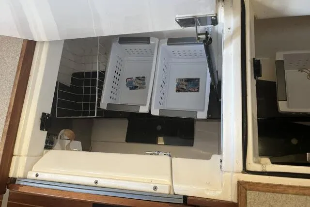 Slide: The Image of Storage compartment with baskets in a 1995 Hunter Legend 40.5 yacht. - 7