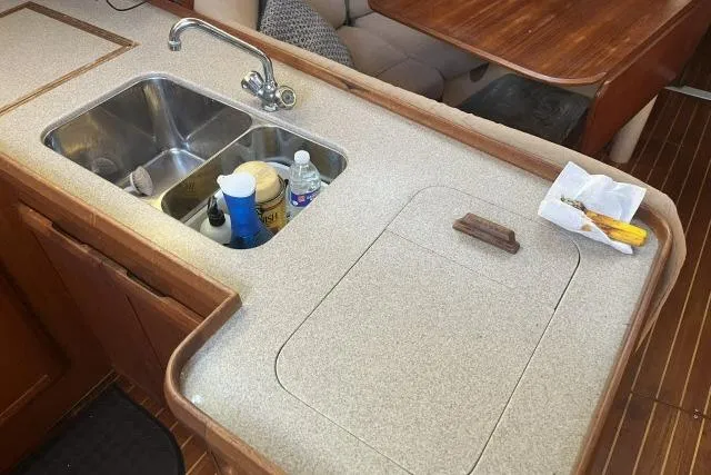Slide: The Image of Interior of 1995 Hunter Legend 40.5 yacht showing kitchen sink and countertop. - 9