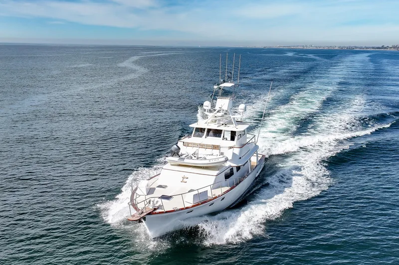 Slide: The Image of 1970 Hargrave Yachtfisher cruising on open sea under clear blue sky. - 17
