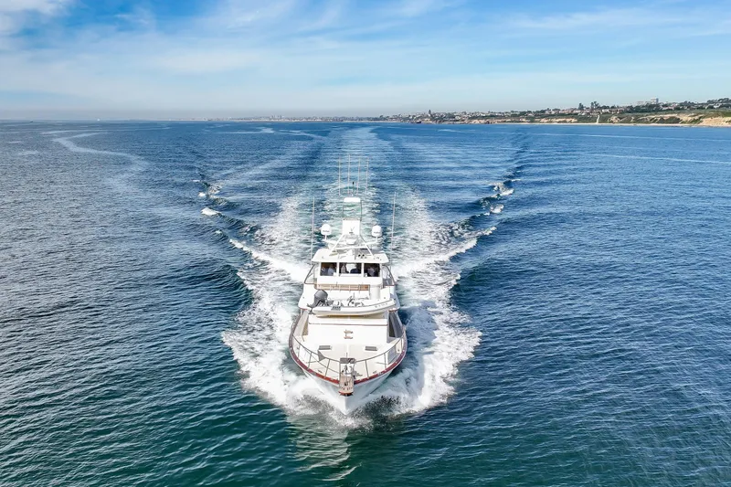 Slide: The Image of 1970 Hargrave Yachtfisher cruising on open sea under clear blue sky. - 18